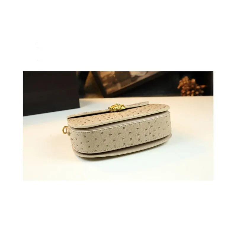 Women's 2026 Spring New Bamboo Handle Bag, New Ostrich Pattern Saddle Style Fashionable High-End Light Luxury Small Square Shoul